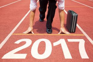 Businessman with briefcase at the starting line of 2017